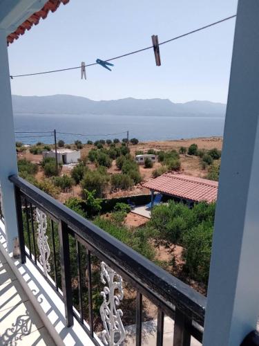 a view of the ocean from the balcony of a house at The Captain in Elafonisos