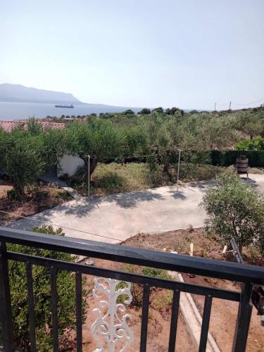 a balcony with a view of the ocean at The Captain in Elafonisos