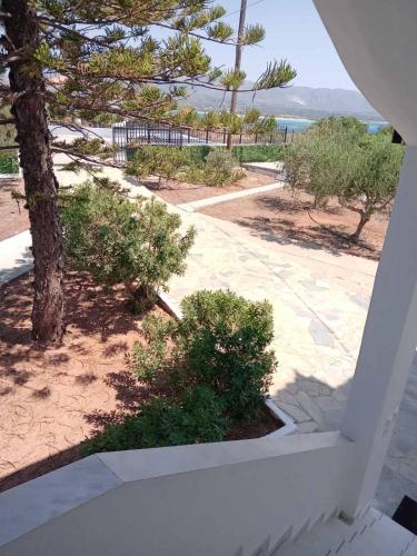a view of the beach from the balcony of a house at The Captain in Elafonisos