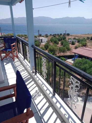 a balcony with a view of the ocean at The Captain in Elafonisos