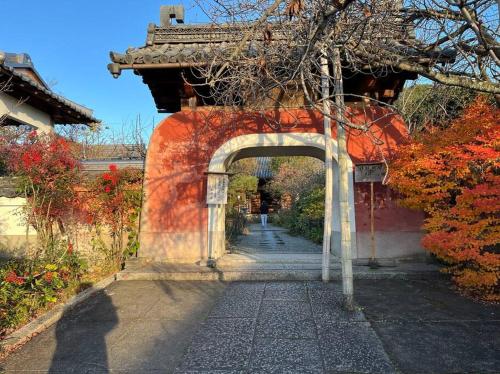 an entrance to a building with an archway at Inari-Home in Kyoto