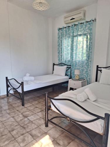 Postel nebo postele na pokoji v ubytování Βig Βlue Apartments