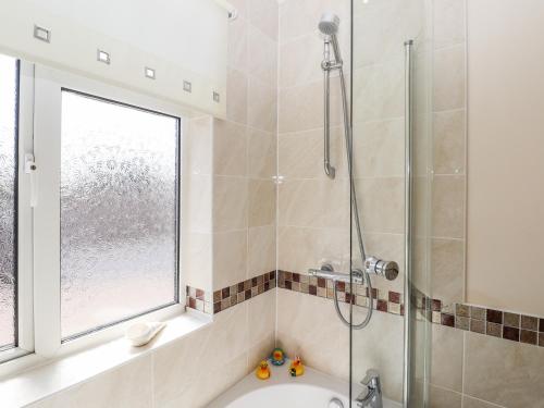 a bathroom with a shower and a sink at Bay Tor in Dover