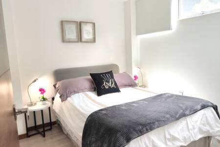 a bedroom with a bed with a pillow on it at Siqueiros Maia Home - Lujoso apto en Polanco cerca de Antara 3BR in Mexico City