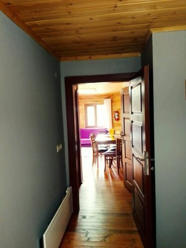 an open door to a dining room with a table at Ayder Rainbow Gokkusagi in Ayder Yaylasi