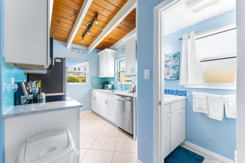 a bathroom with a sink and a toilet at Casa Mar By Beachside Management in Sarasota