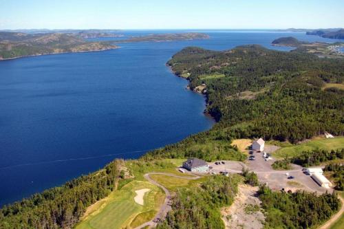 an aerial view of a house on a hill next to a lake at Dory Buff House in Princeton