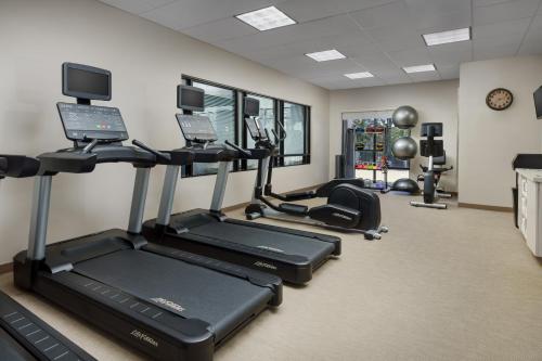 a gym with treadmills and ellipticals in a room at SpringHill Suites Manchester-Boston Regional Airport in Manchester