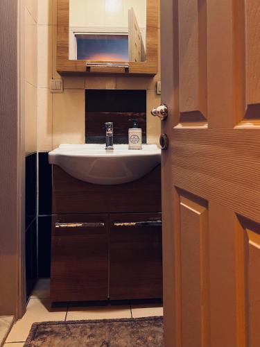a bathroom with a white sink in a room at Pearl of Black Sea in Rize