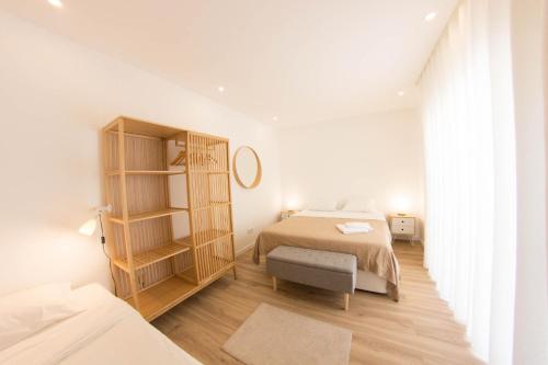 Ένα ή περισσότερα κρεβάτια σε δωμάτιο στο Apartamento Praia Buarcos