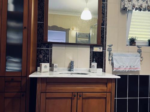 a bathroom with a sink and a mirror at Pearl of Black Sea in Rize