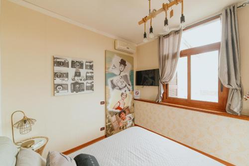 a bedroom with a bed and a window at la terrazza nel centro in Naples