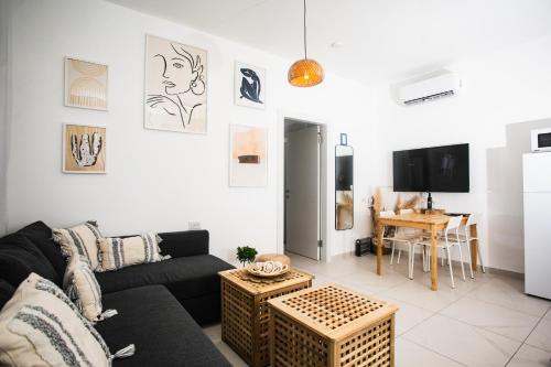 a living room with a couch and a table at LOMA in Hagoshrim