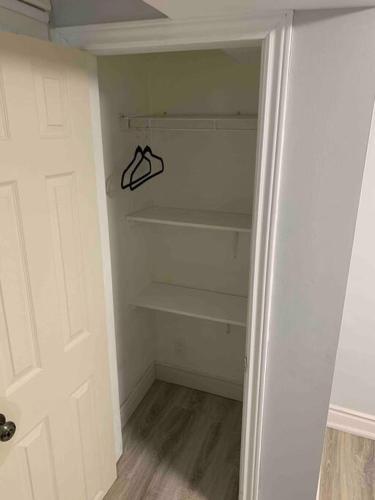 an empty closet with a hanger in a room at Luxury 2 Bedroom House in Richmond Hill