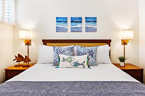 a bedroom with a large bed with pillows at Napili Shores F150 in Napili-Honokowai
