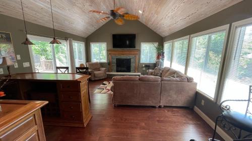 a living room with a couch and a fireplace at Great Escape in New Buffalo