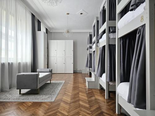 a room with a closet with beds and a chair at The Host in Parma