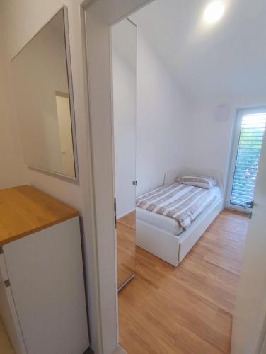 Ένα ή περισσότερα κρεβάτια σε δωμάτιο στο Gaja & Sara Apartments