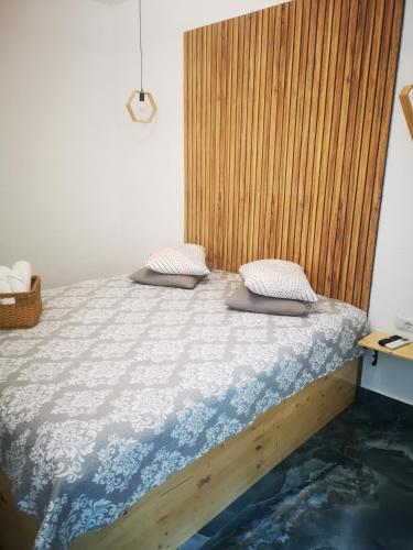 a bed with two pillows on it in a room at Diamond Rezidente III in Timişoara