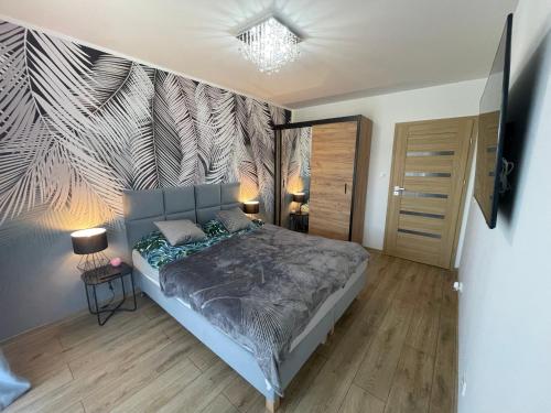 Postel nebo postele na pokoji v ubytování Apartament MK Aparts Dziwnów