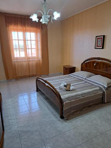 a bedroom with a large bed in a room at Stanze Del Corso in San Marco dei Cavoti