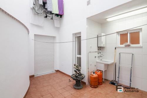 a bathroom with a fire hydrant and a sink at Pedro Jover 9 R&R in Almería