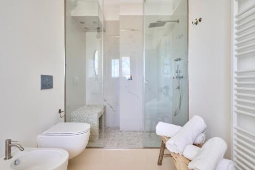 a bathroom with a shower and a toilet and a sink at Agriturismo Borgonuovo in Rimini