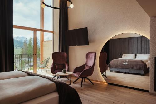 Postel nebo postele na pokoji v ubytování Hotel Lech Da Sompunt