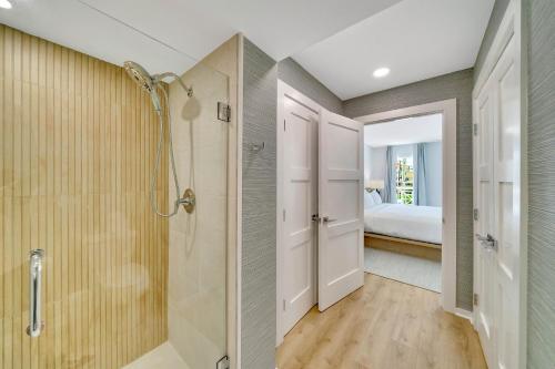 a bathroom with a shower and a walk in shower at Mahalo Cape May Townhomes in Cape May