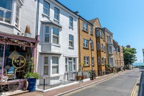 a row of buildings on a city street at Elegant Family Townhouse-Conservation Area-Garden in Kent