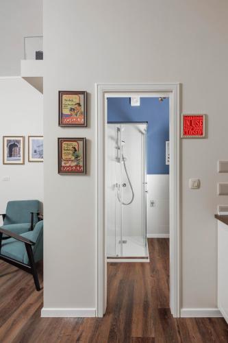 a bathroom with a shower with a glass door at Photel Apartments in Crikvenica