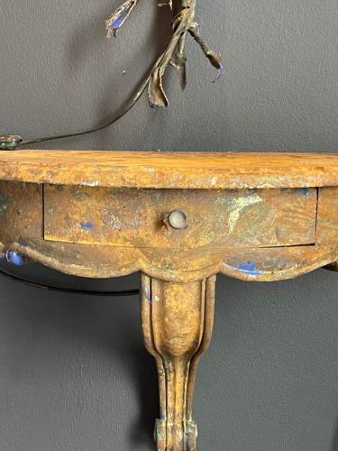 an old wooden table with a branch on top of it at Art Loft in Sint-Martens-Latem