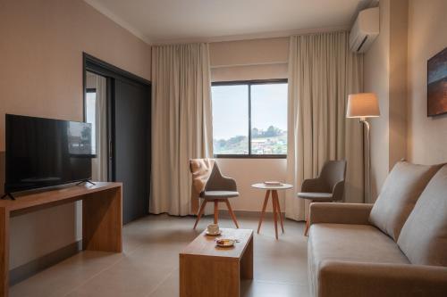 TV a/nebo společenská místnost v ubytování Like Design Hotel Rivera