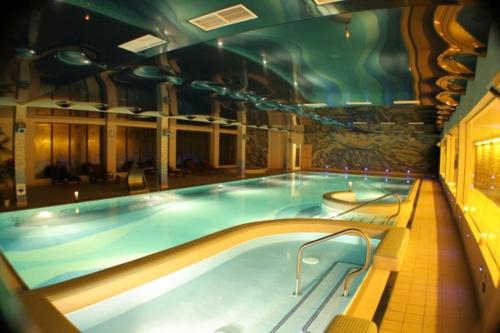 a large indoor swimming pool in a building at Falls Hotel & Spa in Ennistymon