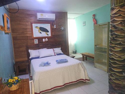 Ein Bett oder Betten in einem Zimmer der Unterkunft Hotel Pueblito Playa