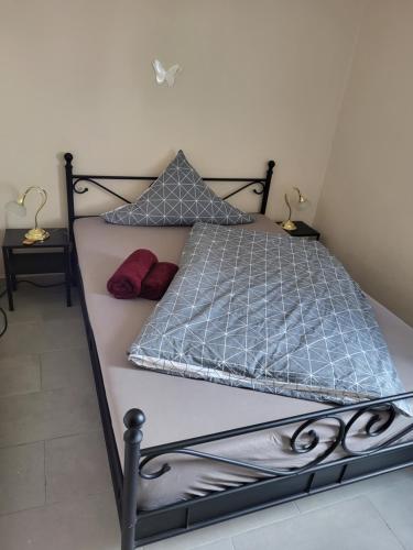 a bedroom with a bed with a metal frame at Ahr-Weinbergblick in Bad Neuenahr-Ahrweiler