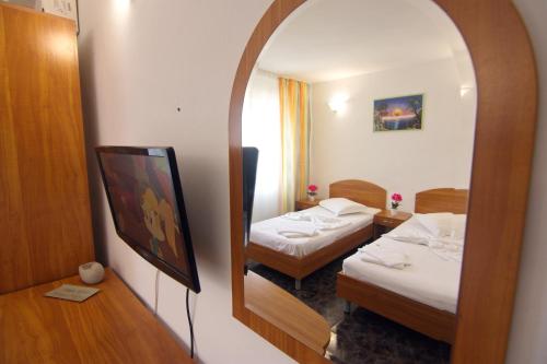 Postel nebo postele na pokoji v ubytování Vila Jasp
