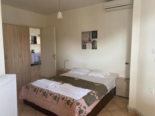 Postel nebo postele na pokoji v ubytování Kelesi Apartments