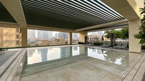 a swimming pool on the roof of a building at SmartStay at Burj Royale - Full Burj Khalifa View - Brand New Luxury Apartments in Dubai