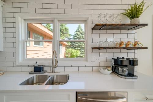 a kitchen with a sink and a window at Beautiful Bellaire Home with Amenities, 4 Mi to Lake in Bellaire
