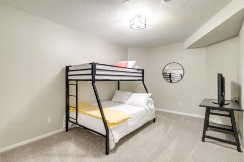 a bedroom with a bunk bed and a desk at Beautiful Bellaire Home with Amenities, 4 Mi to Lake in Bellaire
