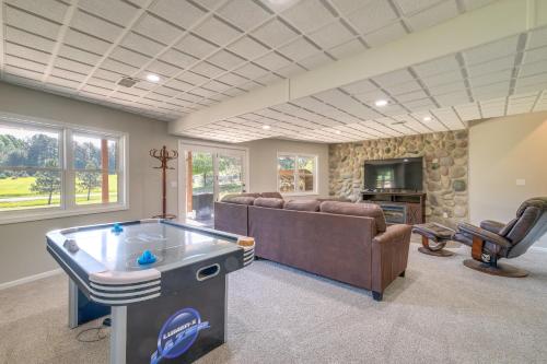 a living room with a couch and a table at Beautiful Bellaire Home with Amenities, 4 Mi to Lake in Bellaire