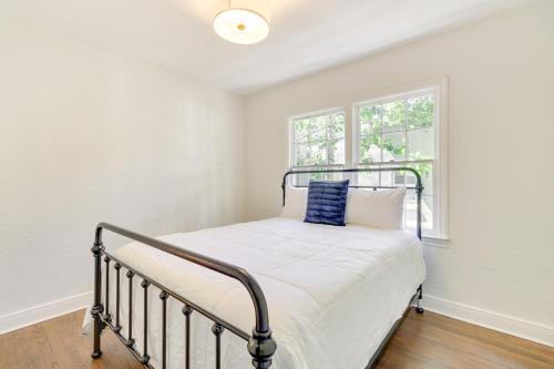 a bed in a room with a window at 1 Mi to Downtown Orlando Home with Fenced Yard! in Orlando