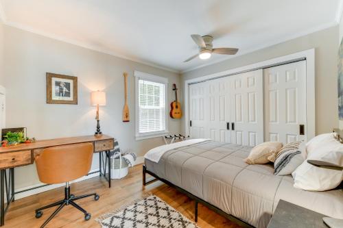 a bedroom with a bed and a desk at Commodore Bay Waterfront Home on Lake Norman! in Mooresville