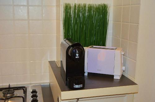 a coffee maker on a counter next to a microwave at La Dimora dell'Arcivescovo in Bari