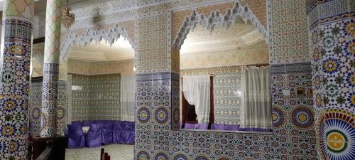 a room with a mirror on a wall at dar rabie in Chefchaouene