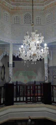 a large chandelier hanging from the ceiling in a building at dar rabie in Chefchaouene