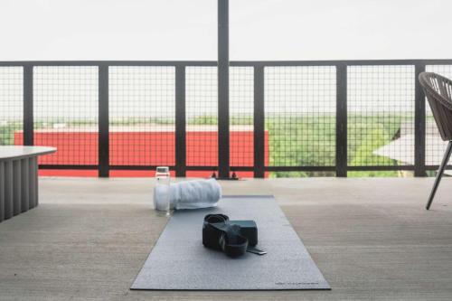 a view of a soccer field with a bottle on a rug at Origin Austin, a Wyndham Hotel in Austin