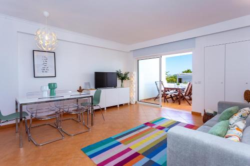 a living room with a couch and a table at Cabanas Sea View APT in Golden in Cabanas de Tavira