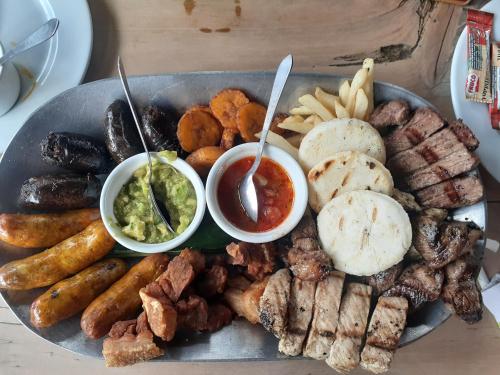a plate of food with different types of food at Glamping eco descanso la vega Nocaima in Nocaima